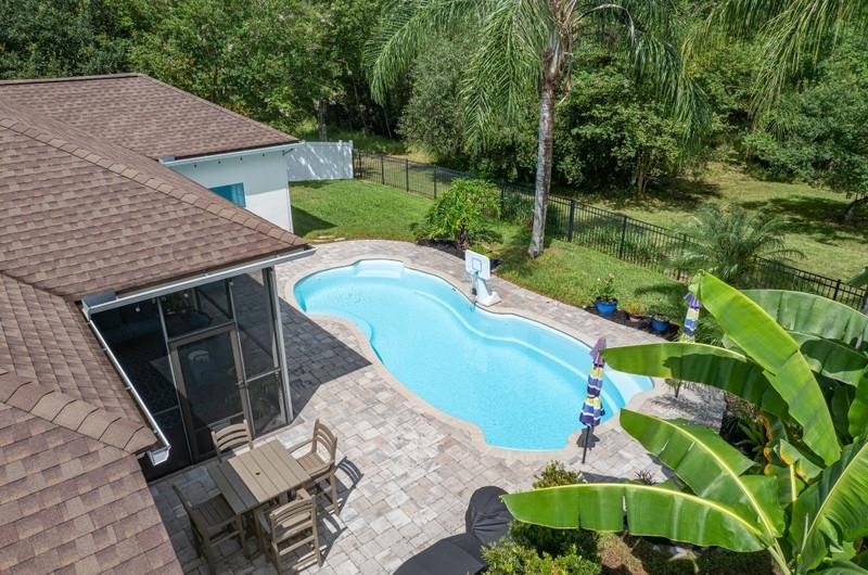 2724 North Portofino Road St. Augustine, FL 32092 - Photo 63 of 86 View of pool with a patio, a fenced backyard, and view of scattered trees