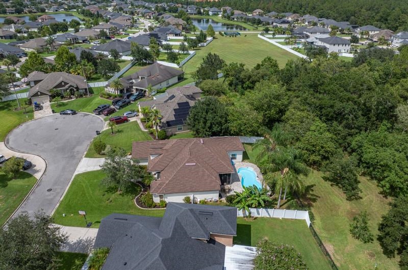 2724 North Portofino Road St. Augustine, FL 32092 - Photo 75 of 86 an aerial view of residential houses with outdoor space and lake view