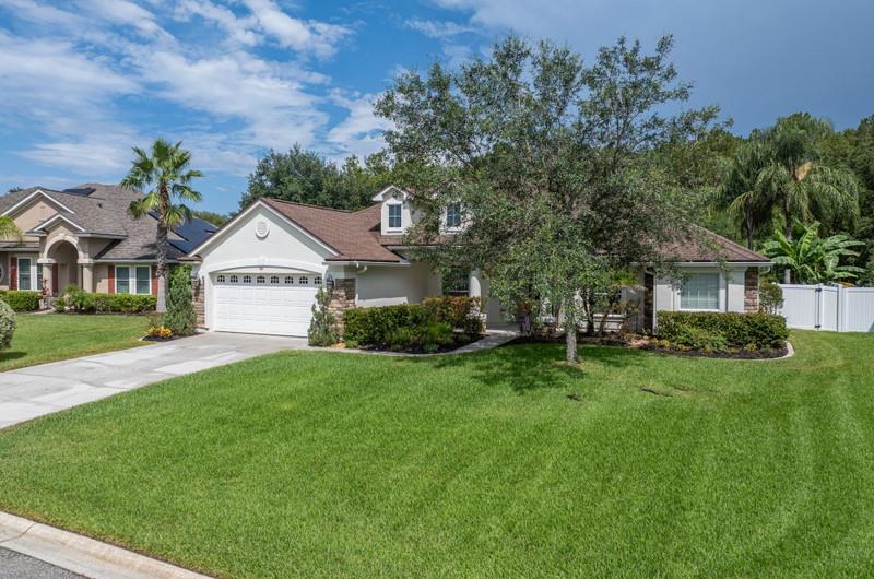 2724 North Portofino Road St. Augustine, FL 32092 - Photo 76 of 86 a front view of a house with a yard