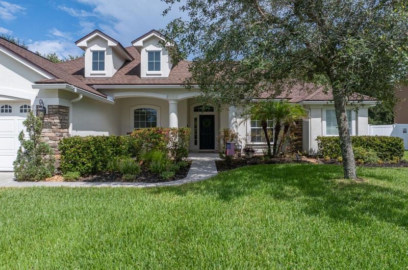2724 North Portofino Road St. Augustine, FL 32092 - Photo 78 of 86 a front view of a house with a yard
