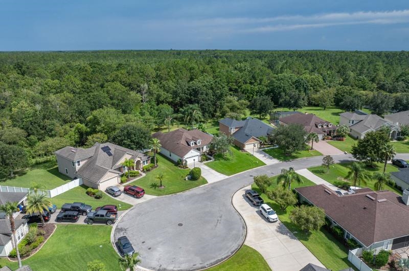 2724 North Portofino Road St. Augustine, FL 32092 - Photo 82 of 86 an aerial view of a house with outdoor space and street view