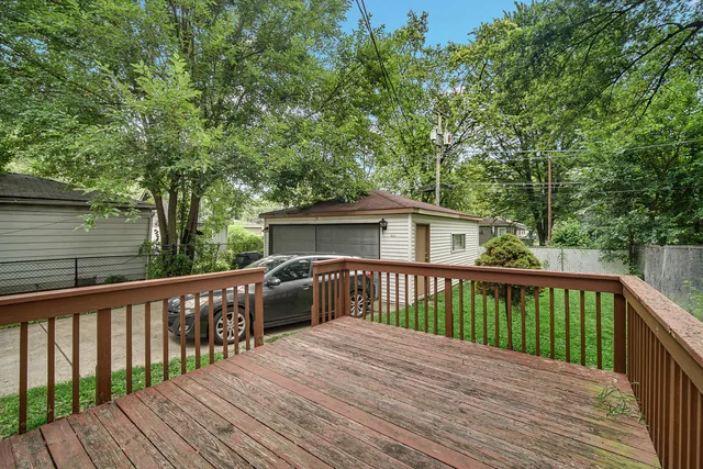 a view of wooden deck and a garden