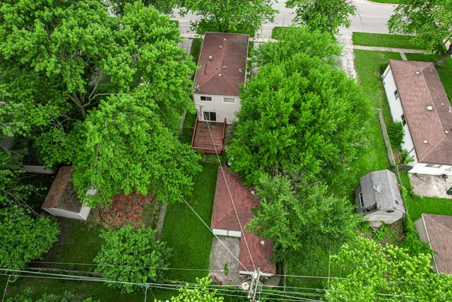 an aerial view of house with yard
