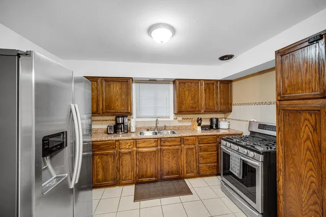 a kitchen with a sink cabinets and stainless steel appliances