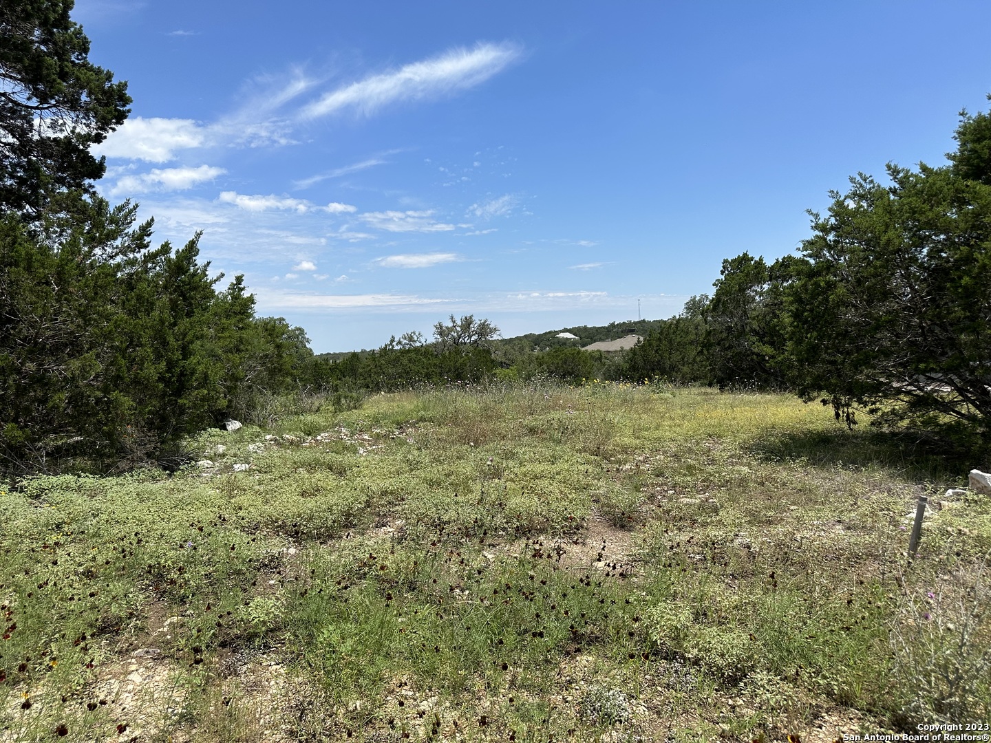7624 Sky Loop Garden Ridge, TX 78266 - Photo 1 of 1 a view of a lake with a yard