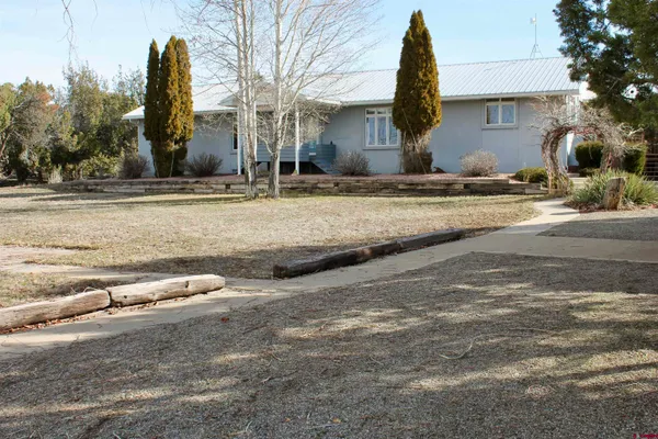 a view of a house with a yard