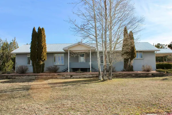 a view of a house with snow on the wall