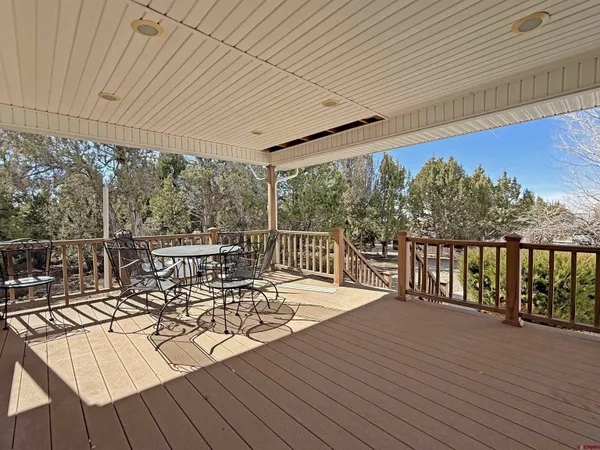 a view of a patio with wooden floor