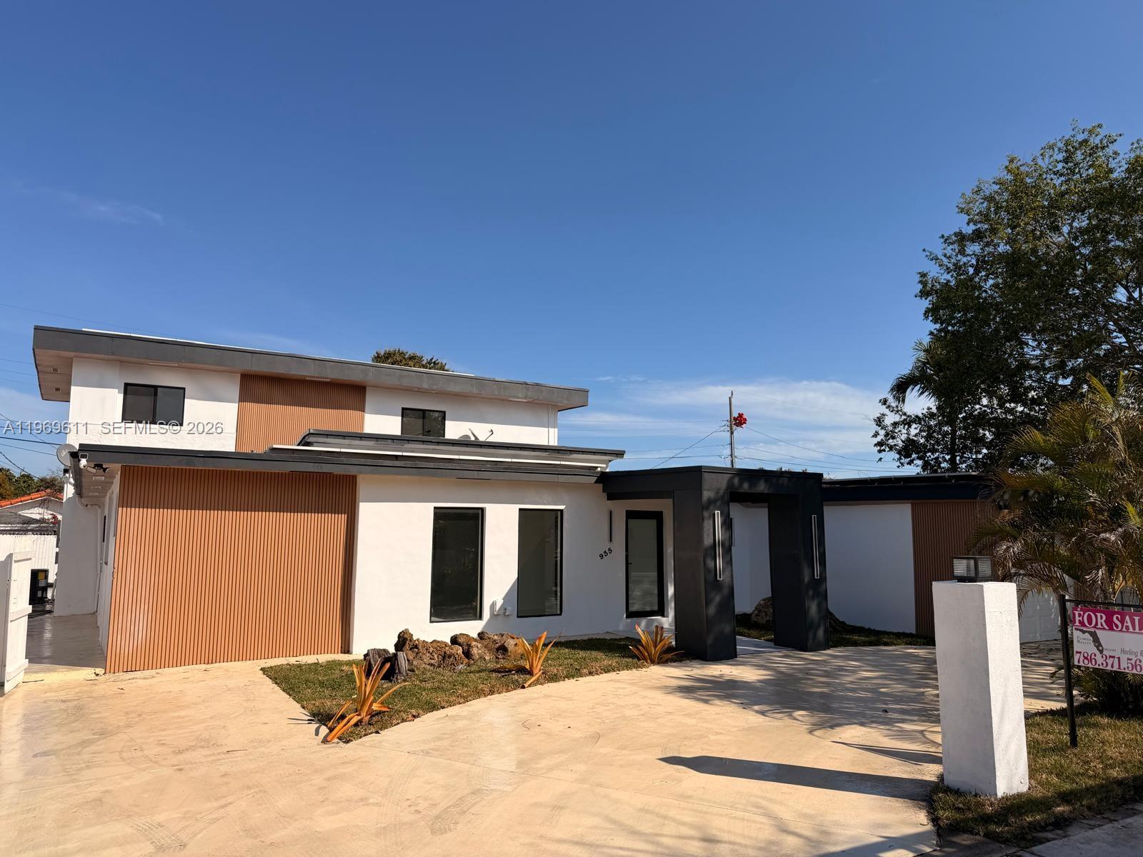 a front view of a house with a outdoor space