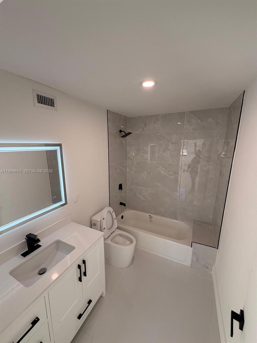 935 Southwest 72nd Avenue Miami, FL 33144 - Photo 13 of 17 a bathroom with a sink a toilet and shower