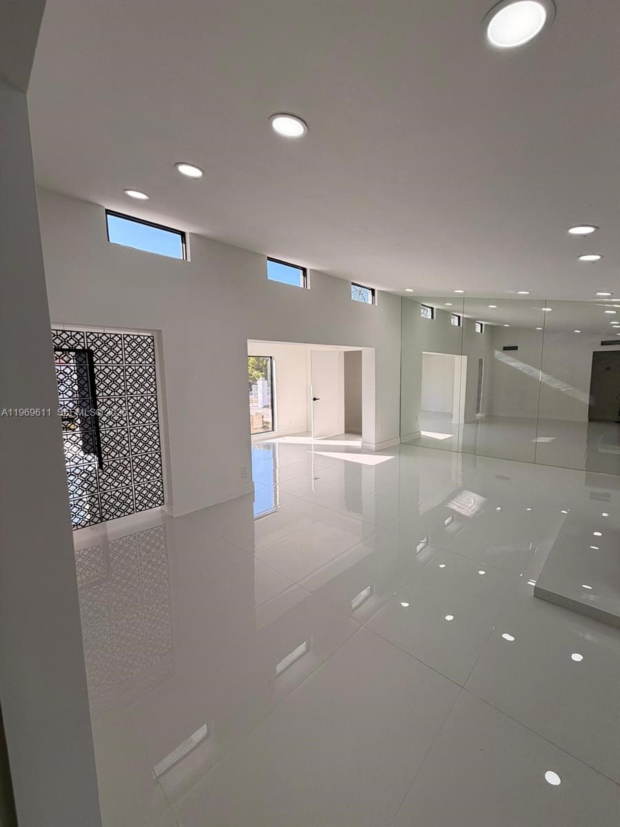 935 Southwest 72nd Avenue Miami, FL 33144 - Photo 15 of 17 a view of a hallway with a projector
