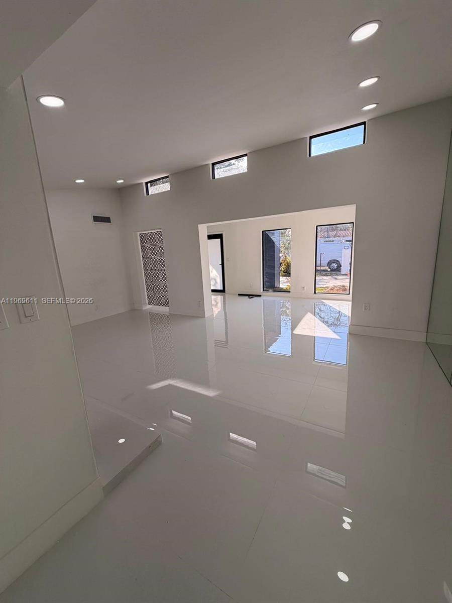 935 Southwest 72nd Avenue Miami, FL 33144 - Photo 8 of 17 a view of a big room with windows and cabinet