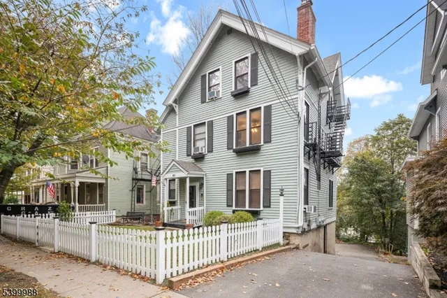 a front view of a house with a porch