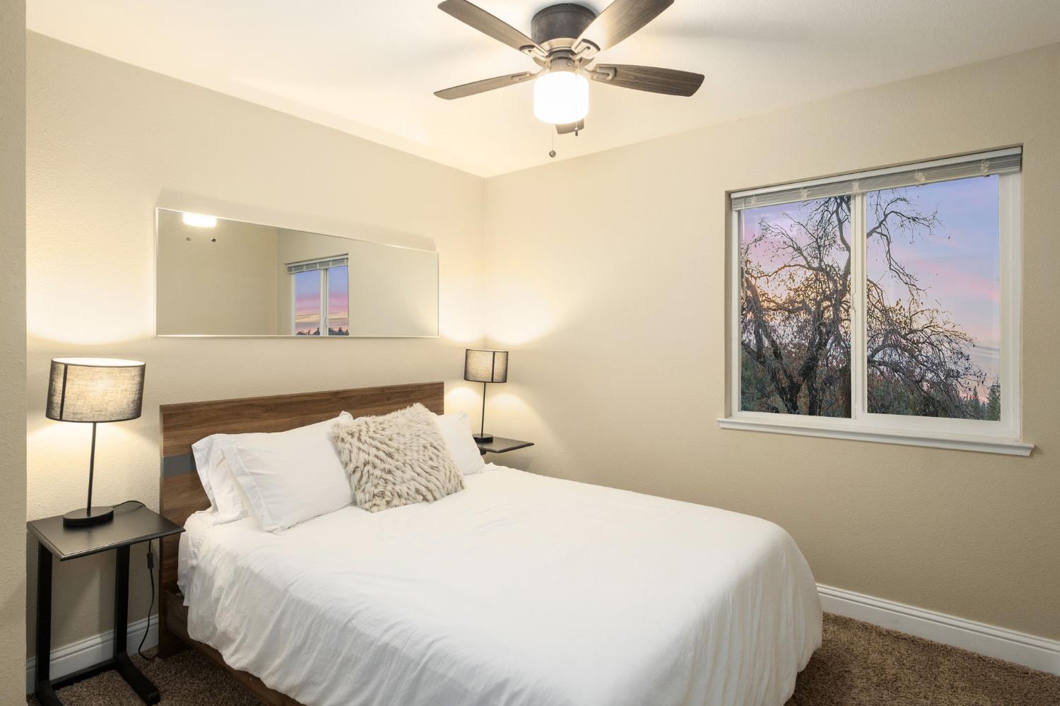 2811 East Westfall Road Mariposa, CA 95338 - Photo 12 of 25 a bedroom with a bed and painting on the wall