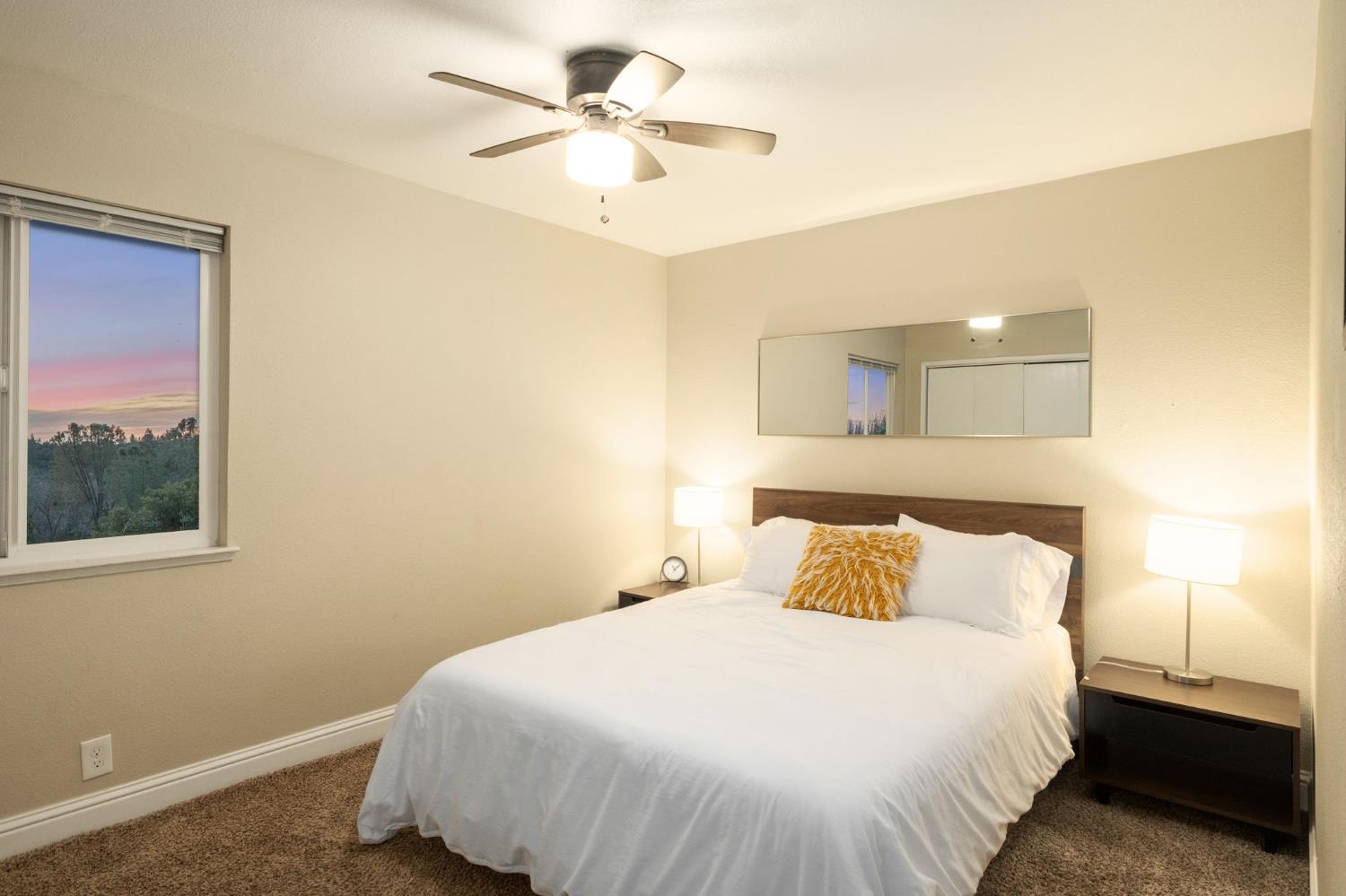 2811 East Westfall Road Mariposa, CA 95338 - Photo 14 of 25 a bedroom with a bed and a lamp