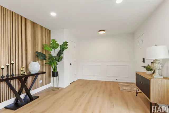 a bedroom with furniture and a potted plant