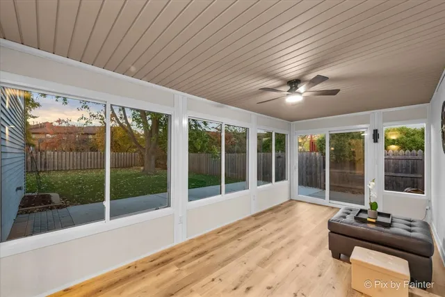 a view of an empty room with windows