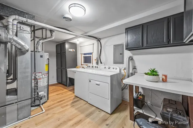 a kitchen with a sink appliances and cabinets