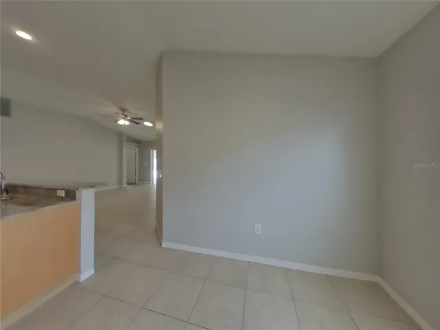 a view of a hallway to an empty room