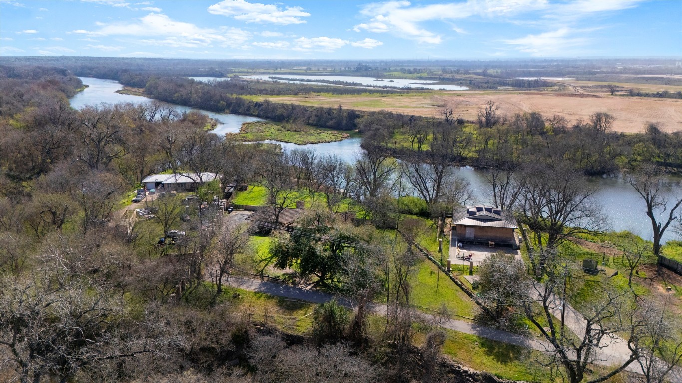 7705 Shelton Road Austin, TX 78725 - Photo 20 of 23 a view of a lake with lawn chairs