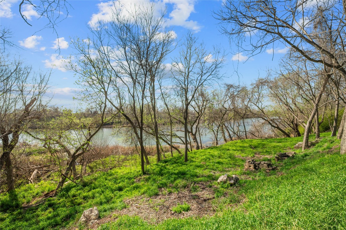 7705 Shelton Road Austin, TX 78725 - Photo 4 of 23 a backyard of a house with lots of green space