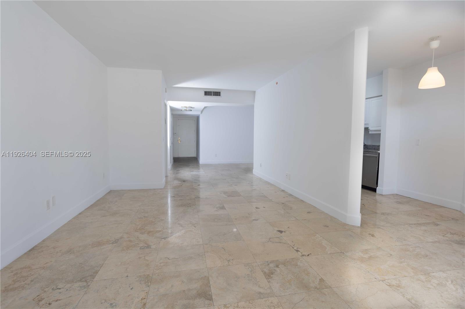 4779 Collins Avenue, Unit 504 Miami Beach, FL 33140 - Photo 13 of 45 an empty room with an entryway