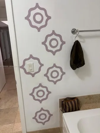 a bathroom with a toilet and a shower curtain