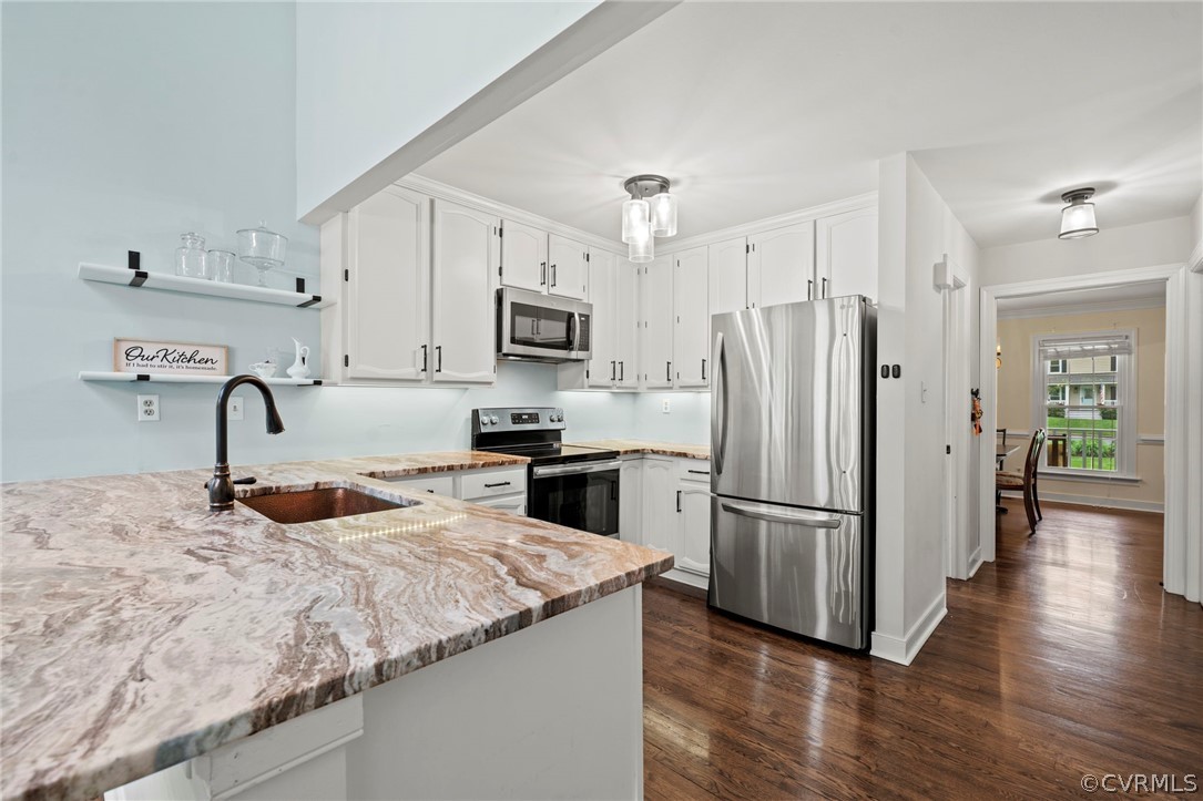 12516 Cutler Ridge Drive Henrico, VA 23233 - Photo 16 of 34 a kitchen with kitchen island granite countertop a refrigerator stove and sink