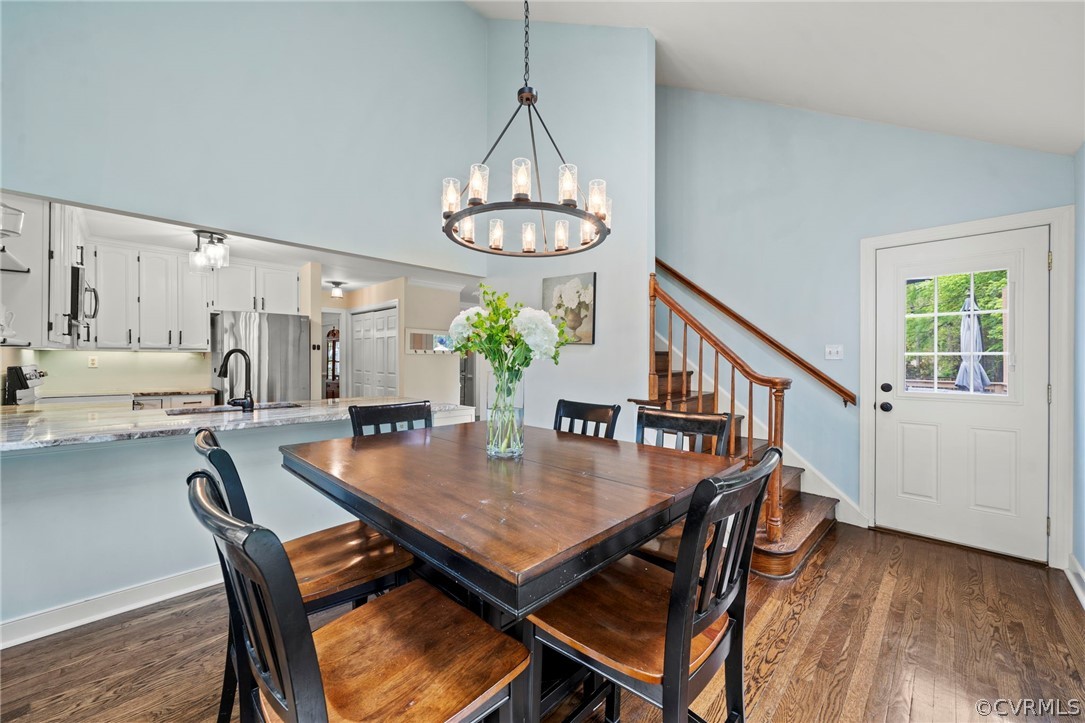 12516 Cutler Ridge Drive Henrico, VA 23233 - Photo 20 of 34 a view of a dining room and livingroom with furniture wooden floor a chandelier