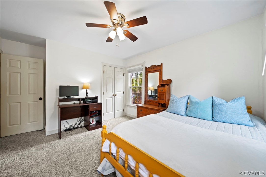 12516 Cutler Ridge Drive Henrico, VA 23233 - Photo 29 of 34 a bedroom with a bed and a chandelier