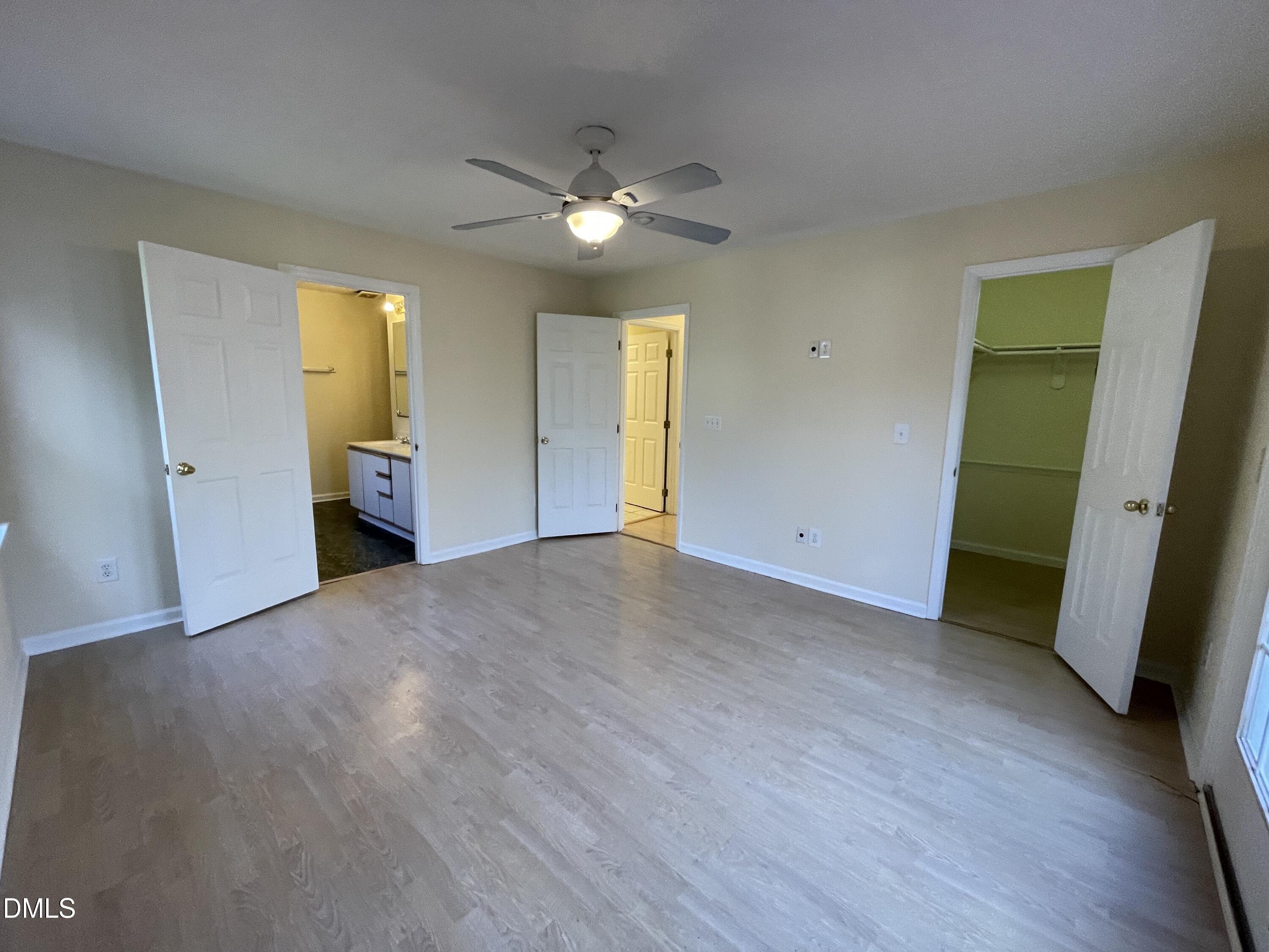 5632 Millrace Trail Raleigh, NC 27606 - Photo 13 of 26 a view of empty room with a fireplace and wooden floor