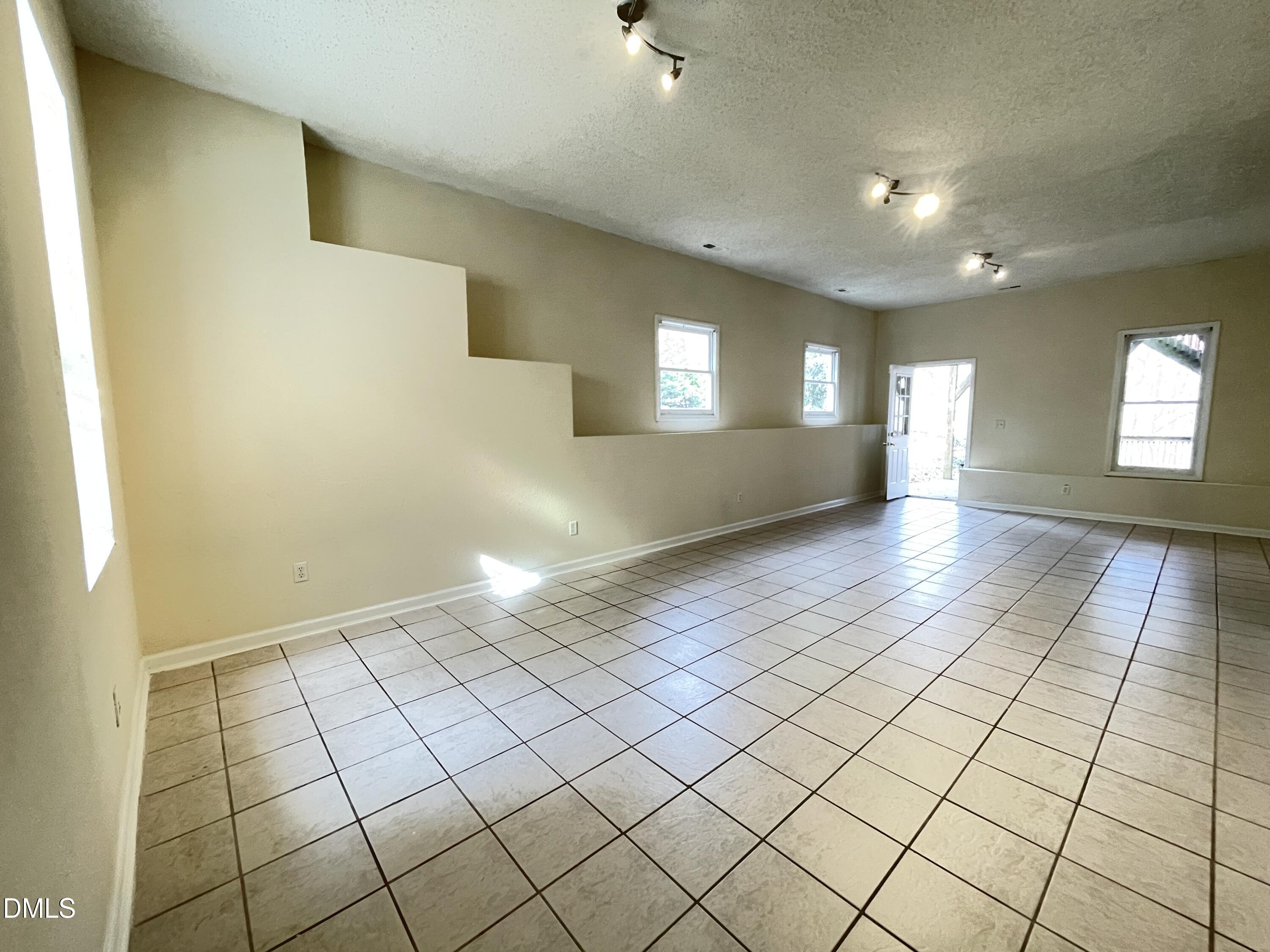 5632 Millrace Trail Raleigh, NC 27606 - Photo 20 of 26 a view of an empty room and window