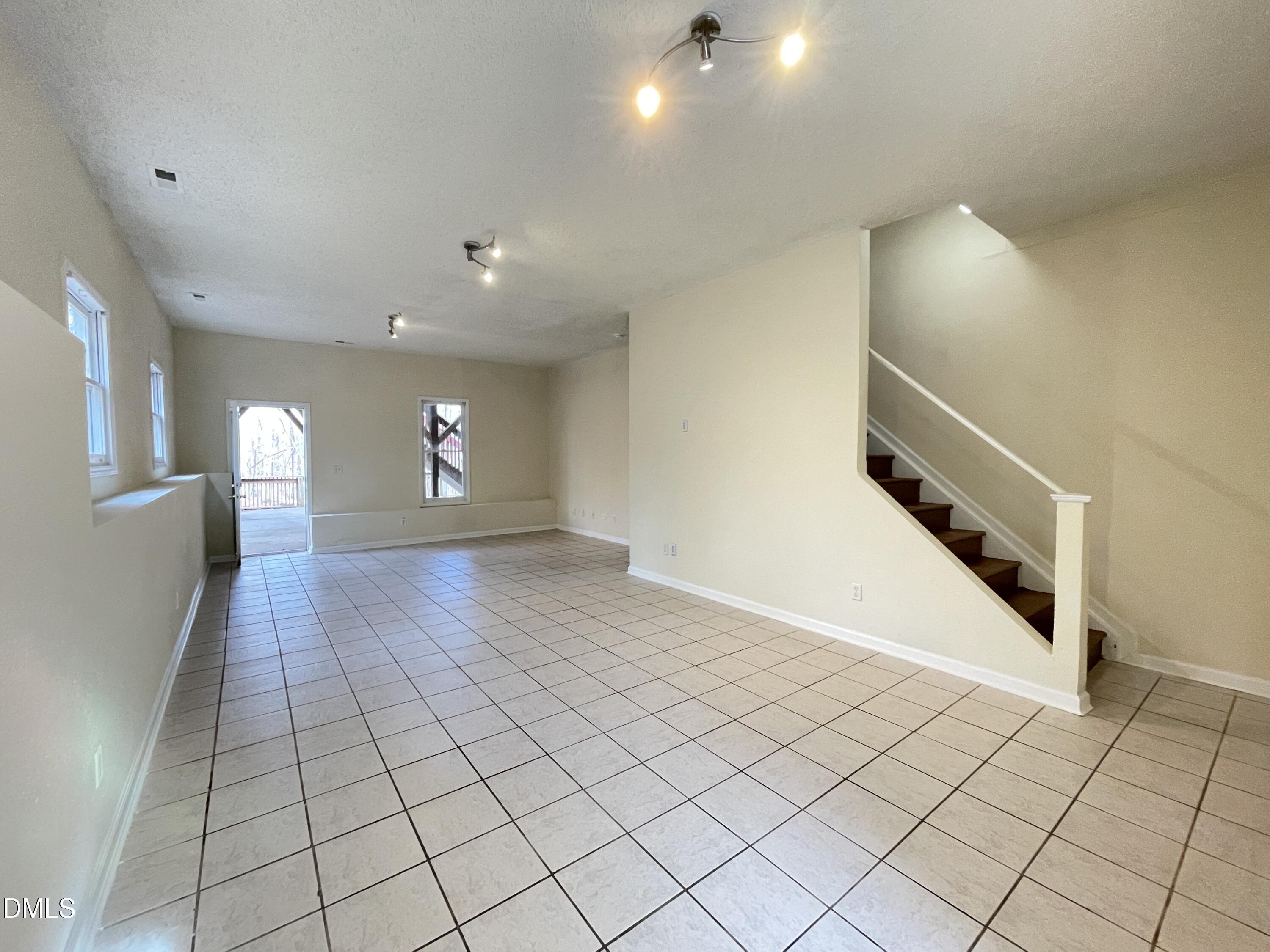 5632 Millrace Trail Raleigh, NC 27606 - Photo 21 of 26 a view of an empty room and a entryway