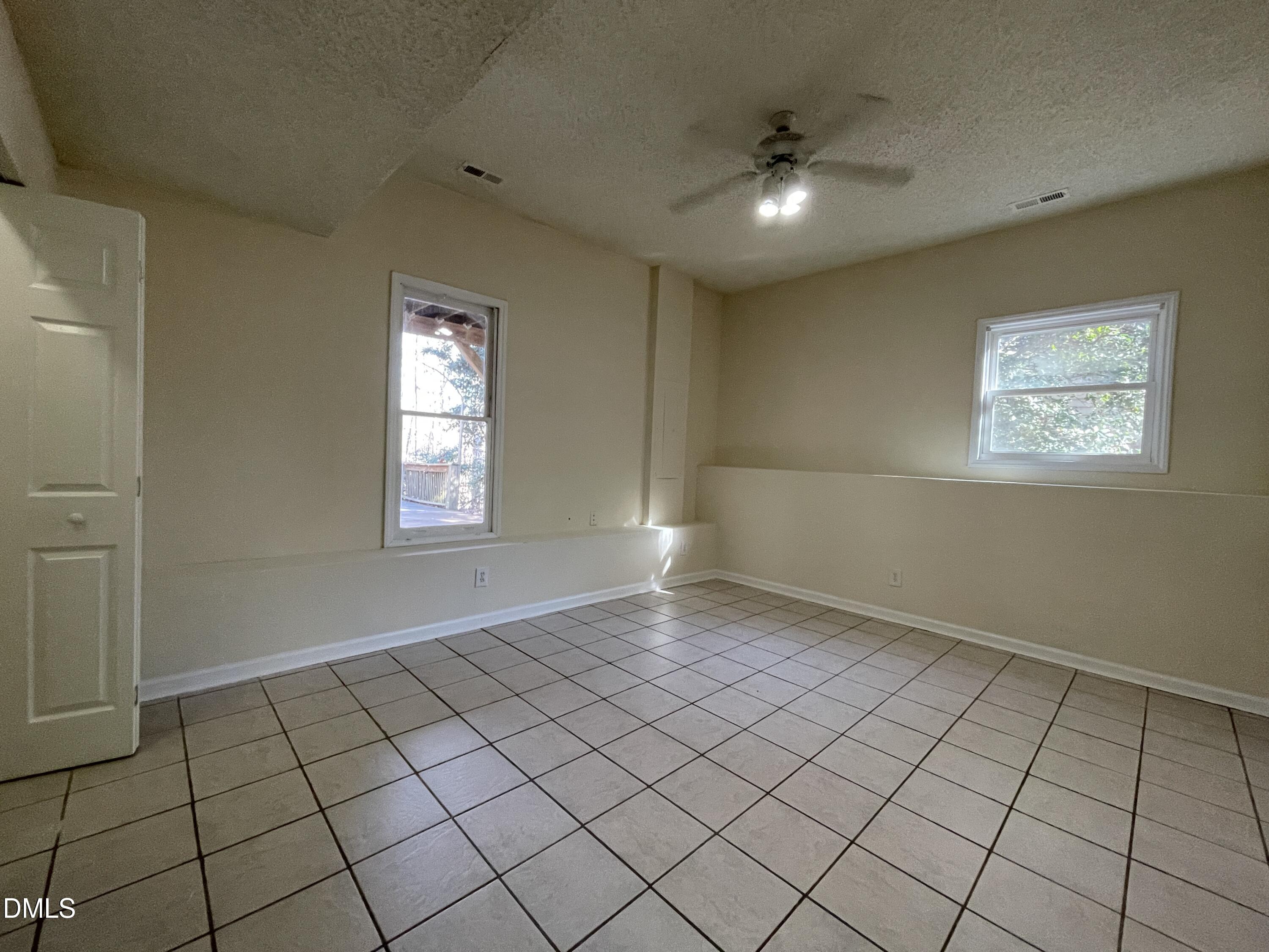 5632 Millrace Trail Raleigh, NC 27606 - Photo 22 of 26 an empty room with windows and closet