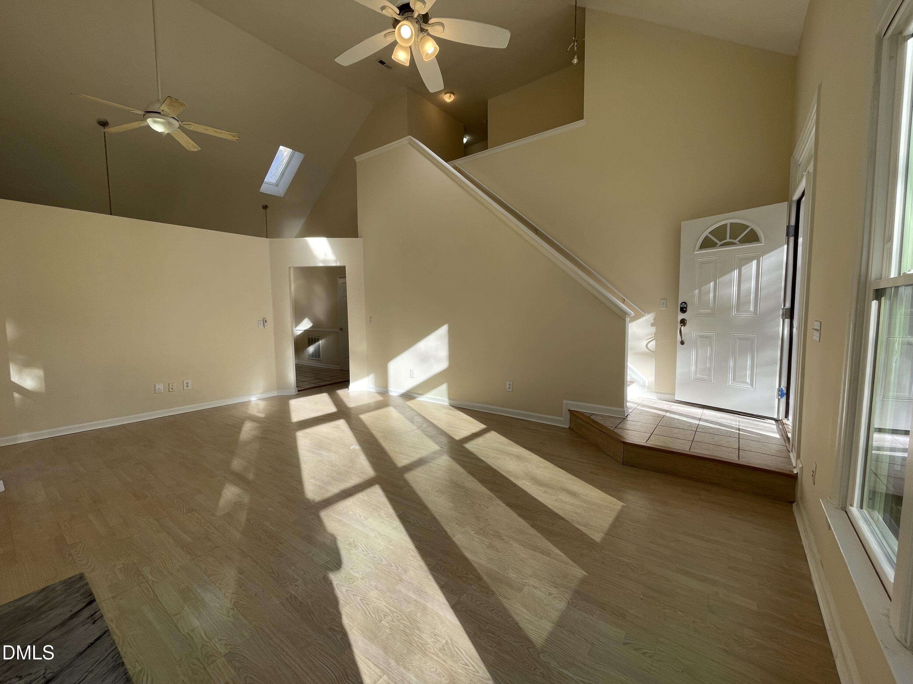 5632 Millrace Trail Raleigh, NC 27606 - Photo 7 of 26 a view of a living room with a bed