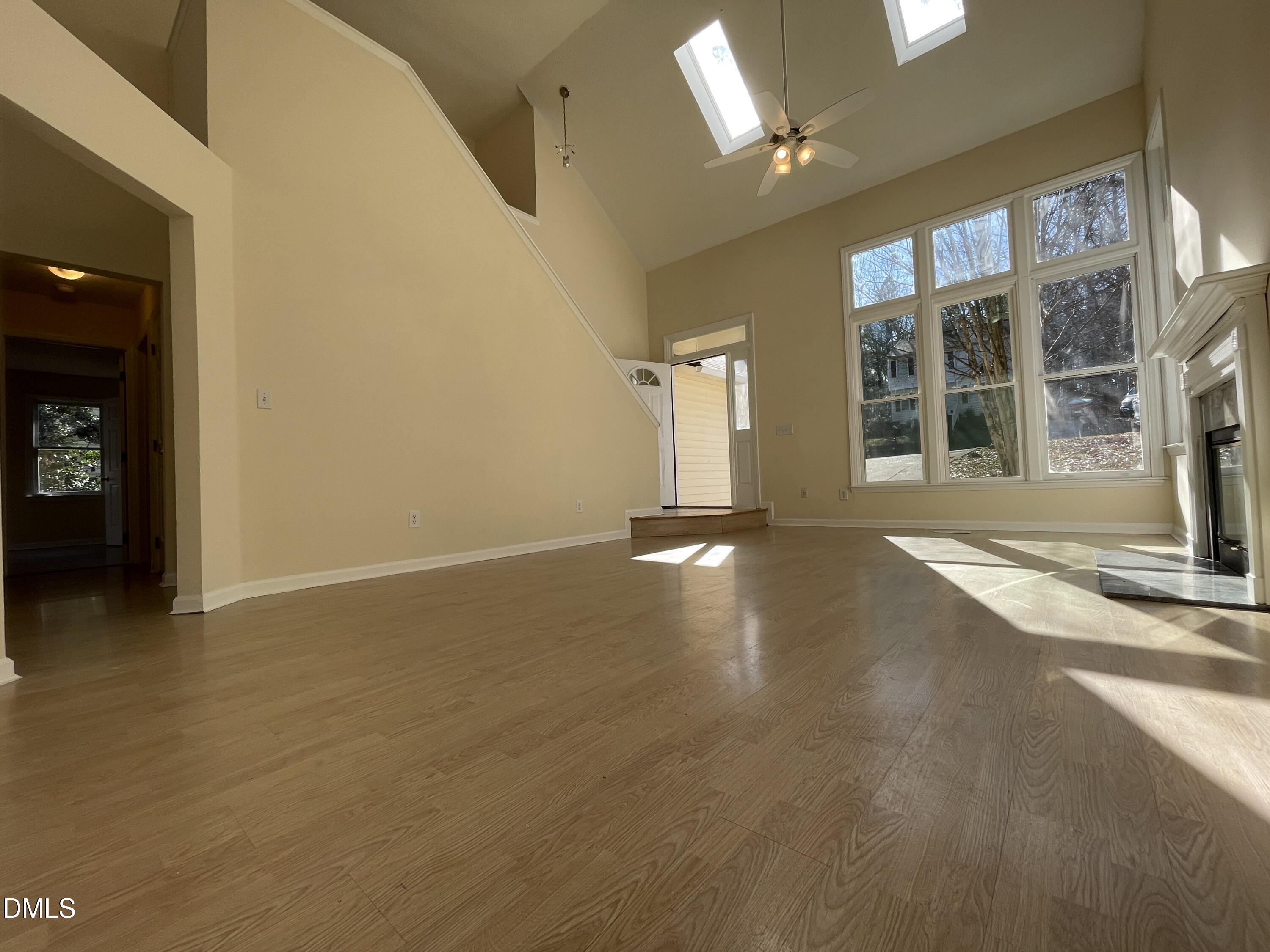 5632 Millrace Trail Raleigh, NC 27606 - Photo 8 of 26 a view of an empty room with a window