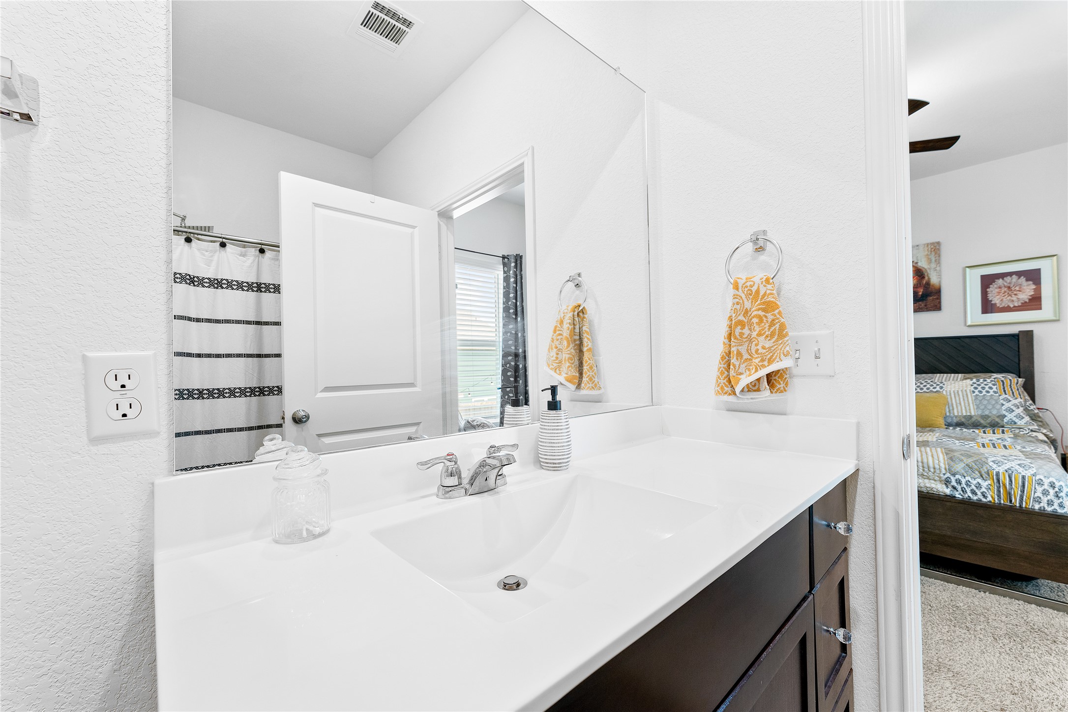 6009 Jagger Avenue Austin, TX 78747 - Photo 16 of 24 a bathroom with a sink vanity and mirror