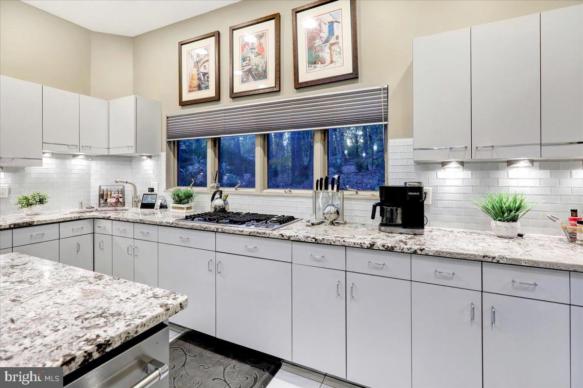 14 Pine Ridge Lane Reading, PA 19607 - Photo 15 of 66 a kitchen with granite countertop white cabinets and a sink