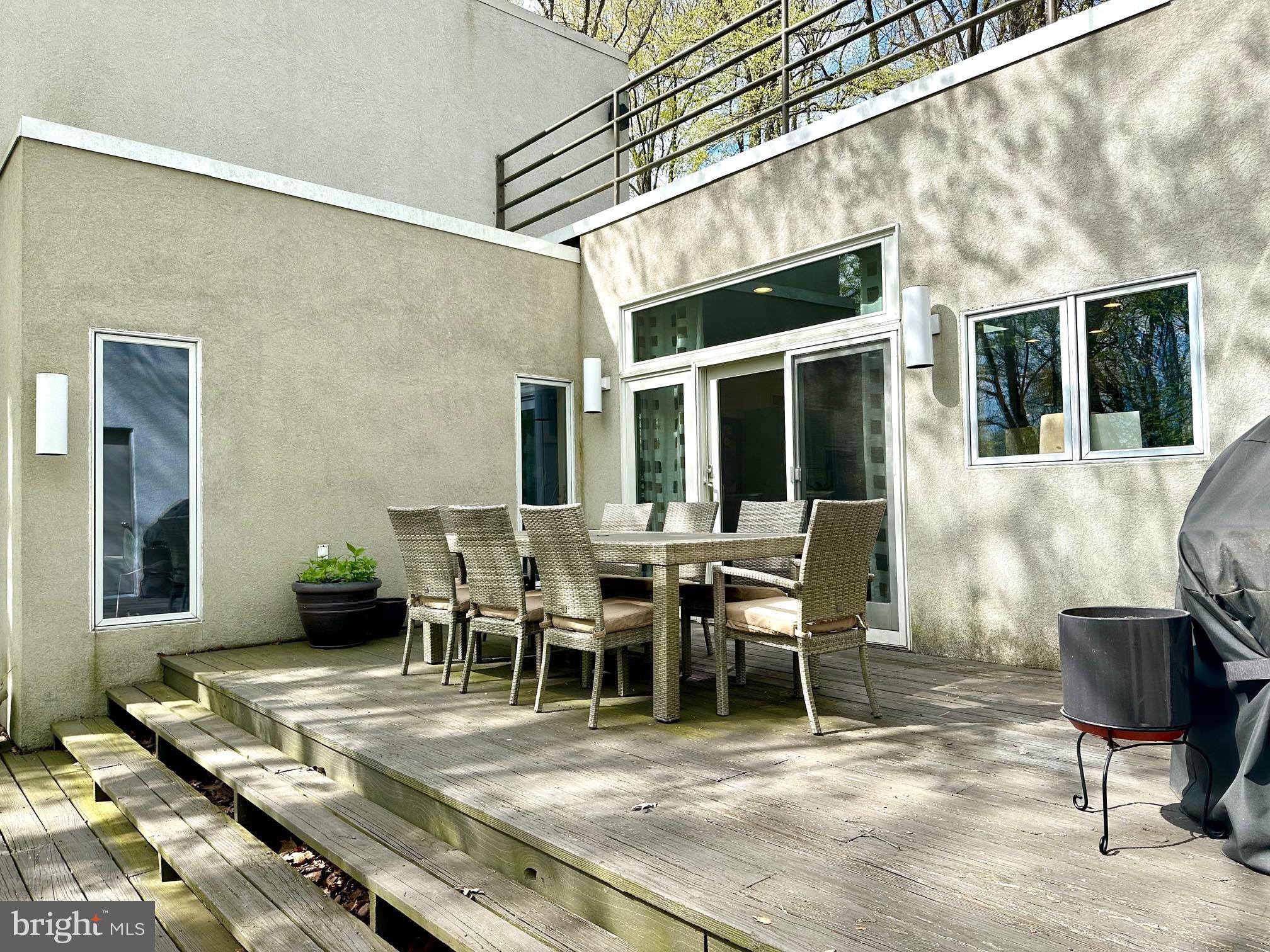 14 Pine Ridge Lane Reading, PA 19607 - Photo 21 of 66 a view of a patio with table and chairs and wooden floor