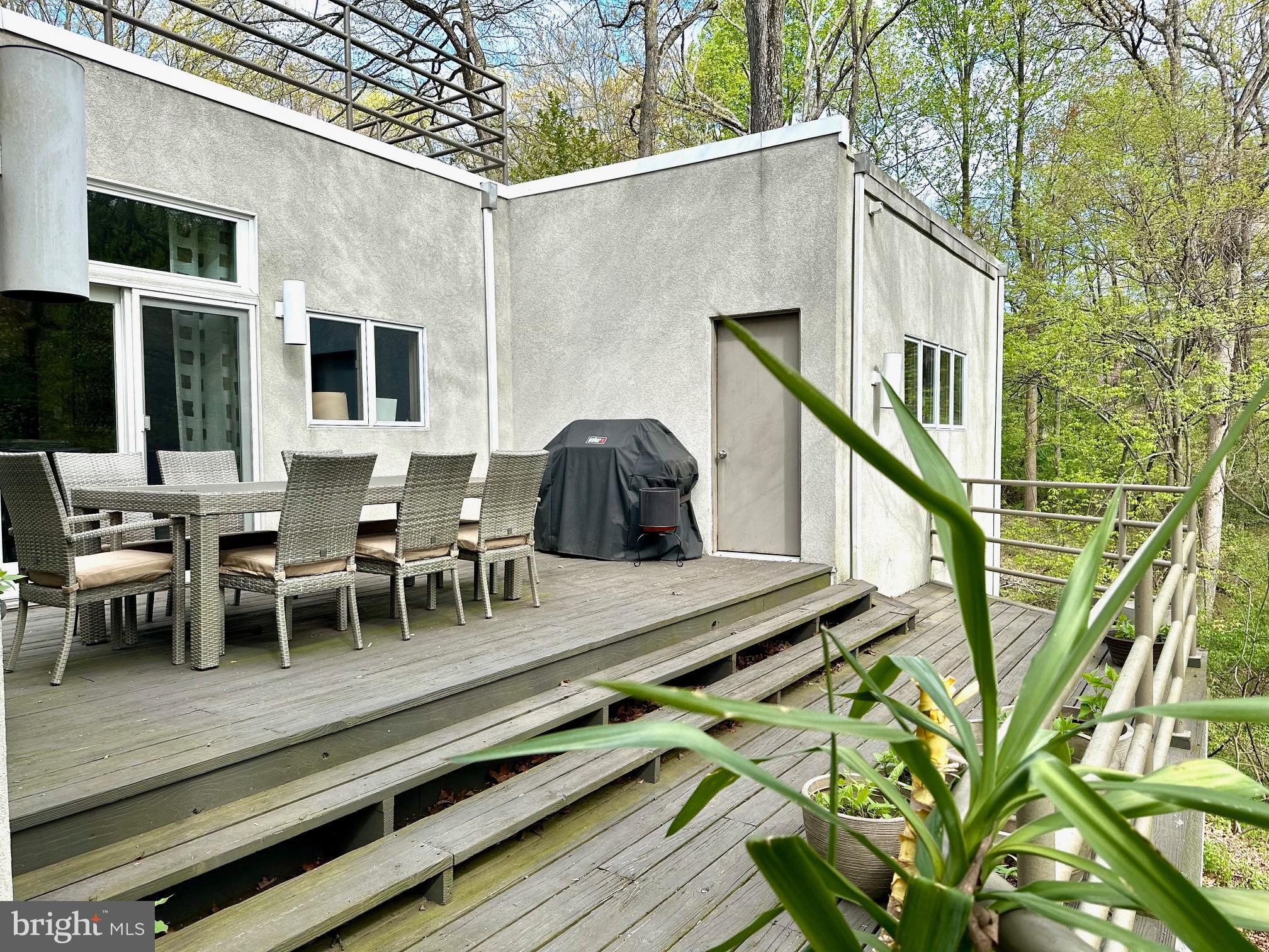 14 Pine Ridge Lane Reading, PA 19607 - Photo 22 of 66 a view of deck with table and chairs with wooden floor and fence