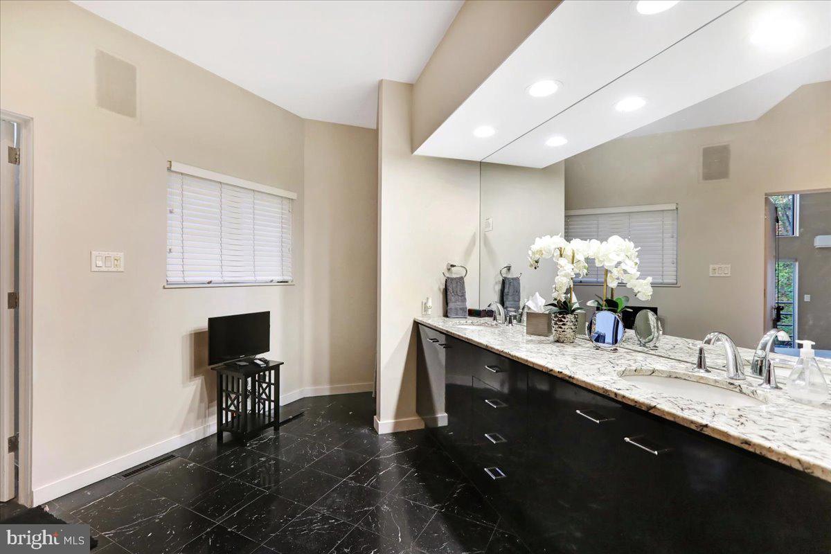 14 Pine Ridge Lane Reading, PA 19607 - Photo 29 of 66 a spacious bathroom with a double vanity sink and a mirror