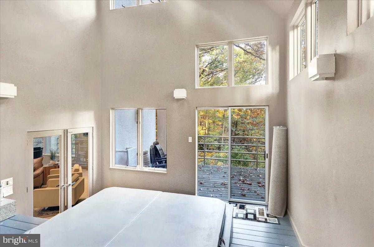 14 Pine Ridge Lane Reading, PA 19607 - Photo 31 of 66 a bedroom with a large window and a wooden floor