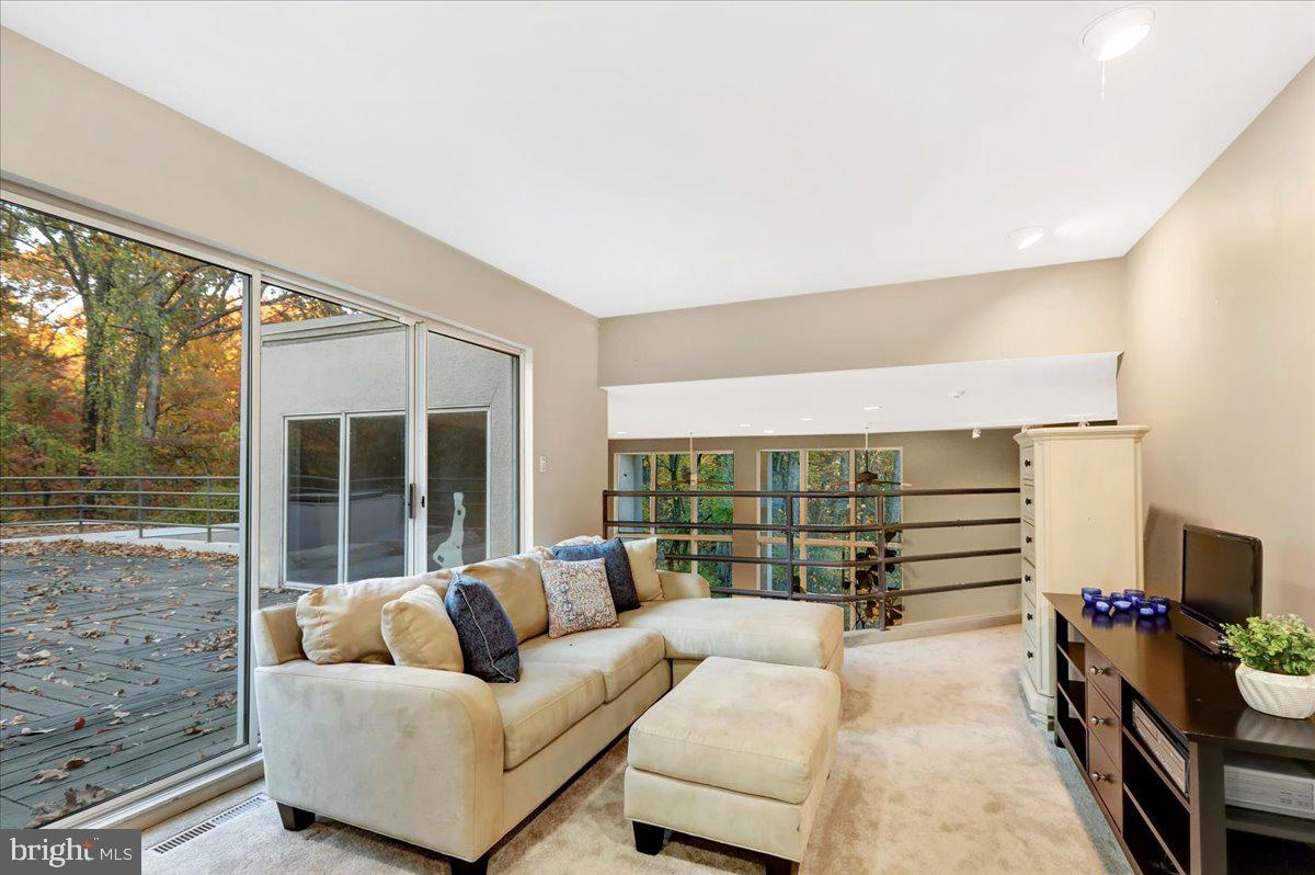14 Pine Ridge Lane Reading, PA 19607 - Photo 39 of 66 a living room with furniture and a floor to ceiling window