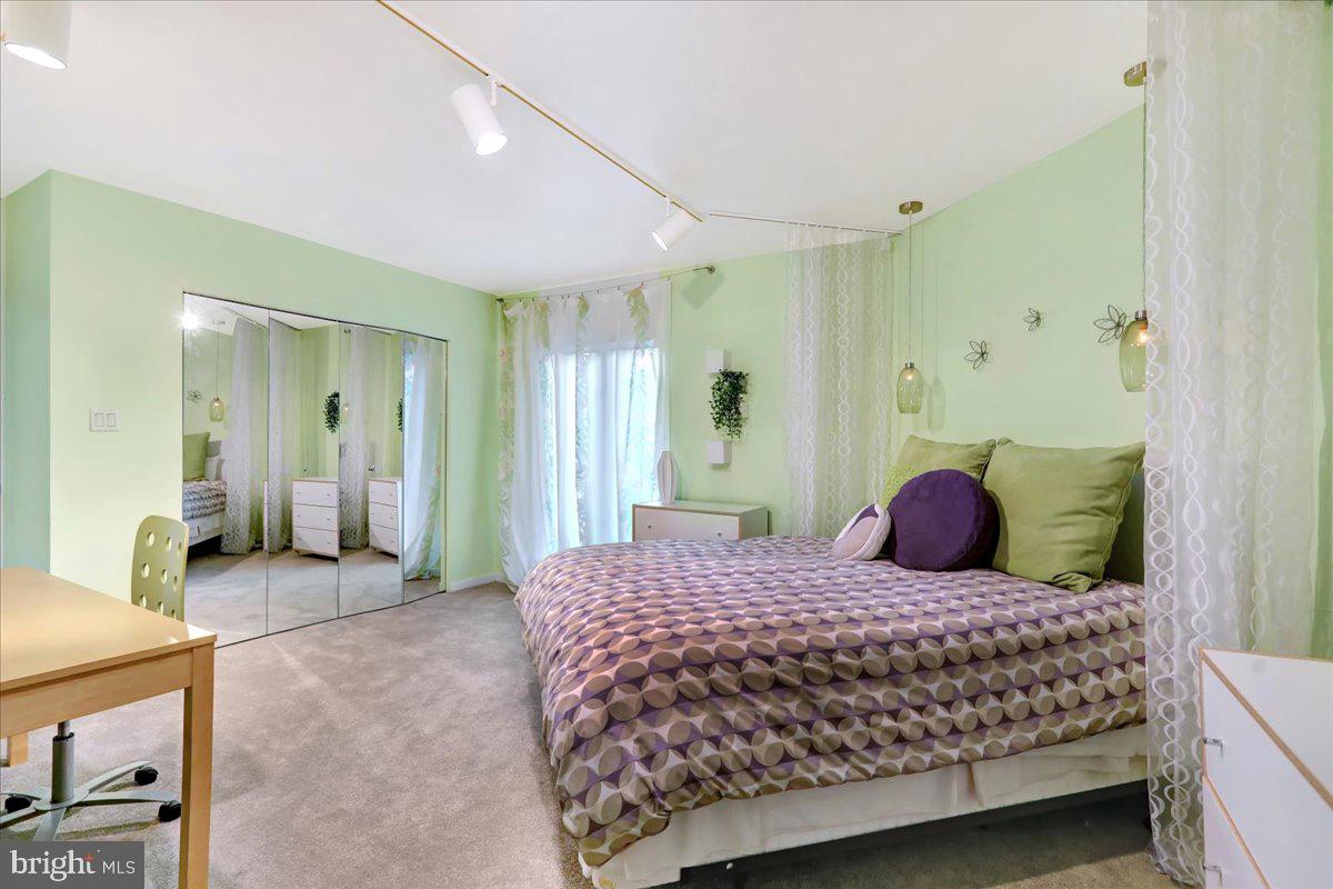 14 Pine Ridge Lane Reading, PA 19607 - Photo 46 of 66 a bedroom with a large bed and a chandelier