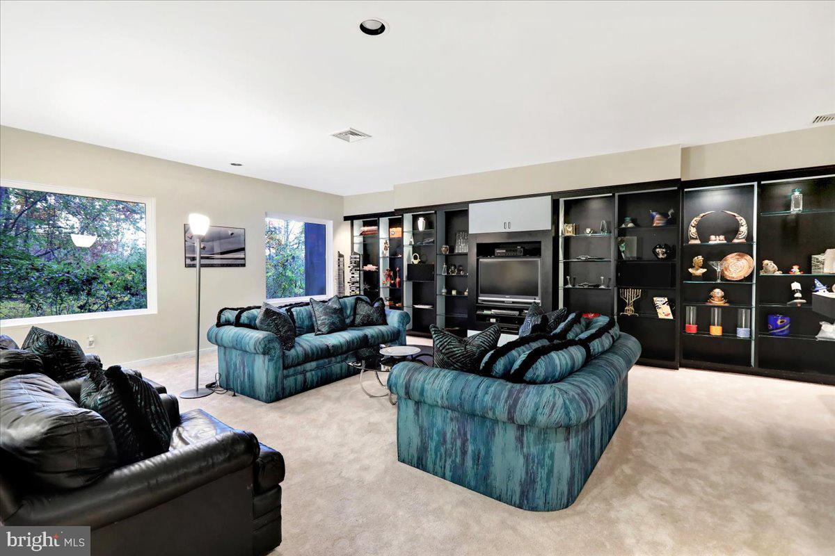 14 Pine Ridge Lane Reading, PA 19607 - Photo 55 of 66 a living room with furniture and a floor to ceiling window