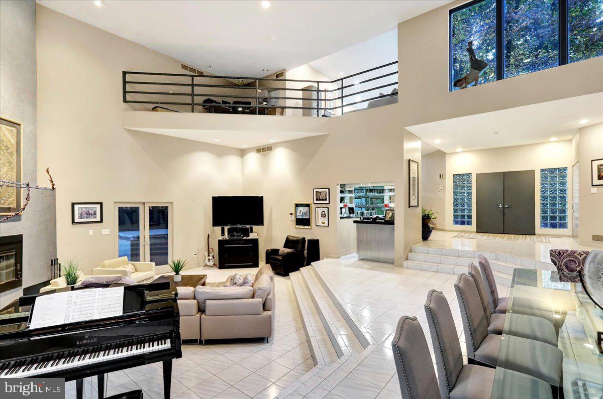 14 Pine Ridge Lane Reading, PA 19607 - Photo 9 of 66 a living room with furniture a flat screen tv and kitchen view