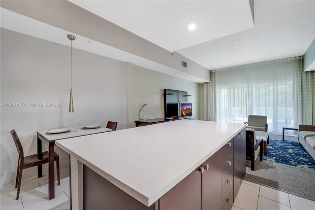 a view of kitchen with cabinets and wooden floor
