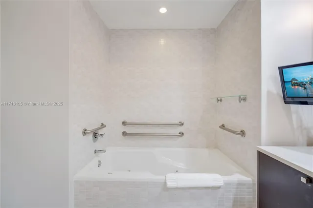 a bathroom with a granite countertop sink a toilet and shower