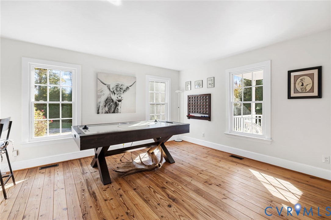 6256 Old Buckingham Road Powhatan, VA 23139 - Photo 11 of 48 a living room with furniture and a wooden floor