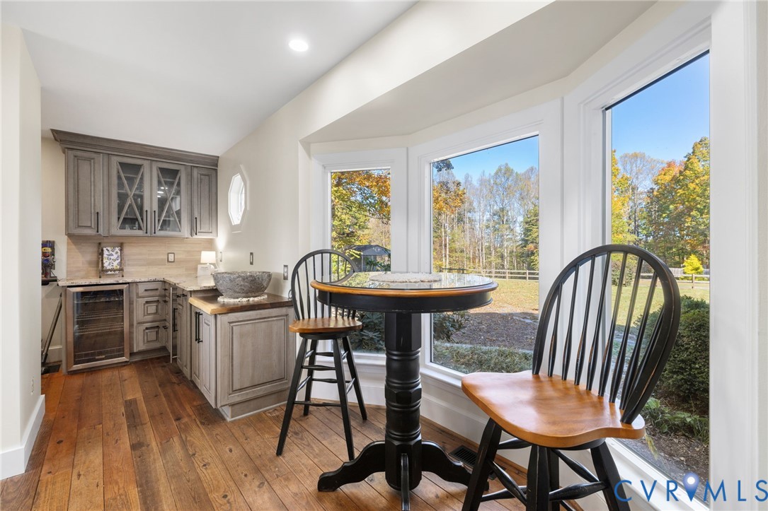 6256 Old Buckingham Road Powhatan, VA 23139 - Photo 14 of 48 a view of a dining room with furniture window and wooden floor